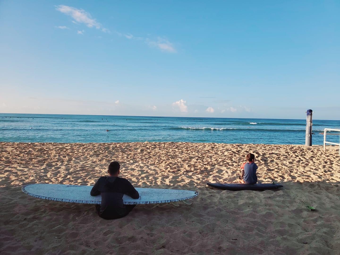 Boy on surfboard on Hawaii beach